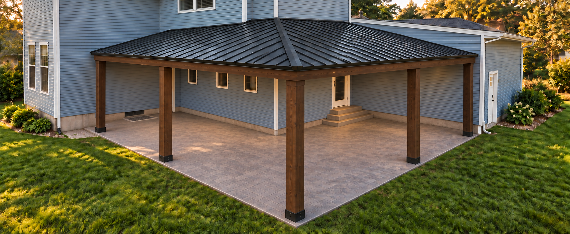 Phase one with stamped concrete, timber posts and a completed black metal roof